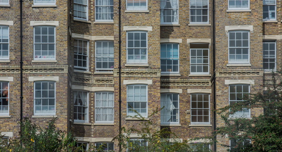 A front facing image of an apartment block's windows