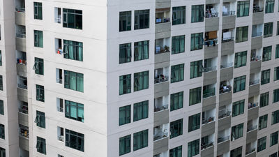 An Architectual image of the side of an apartment from midway up