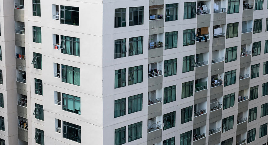 An Architectual image of the side of an apartment from midway up