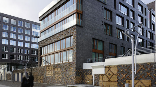 An architectual image of an apartment block from the street